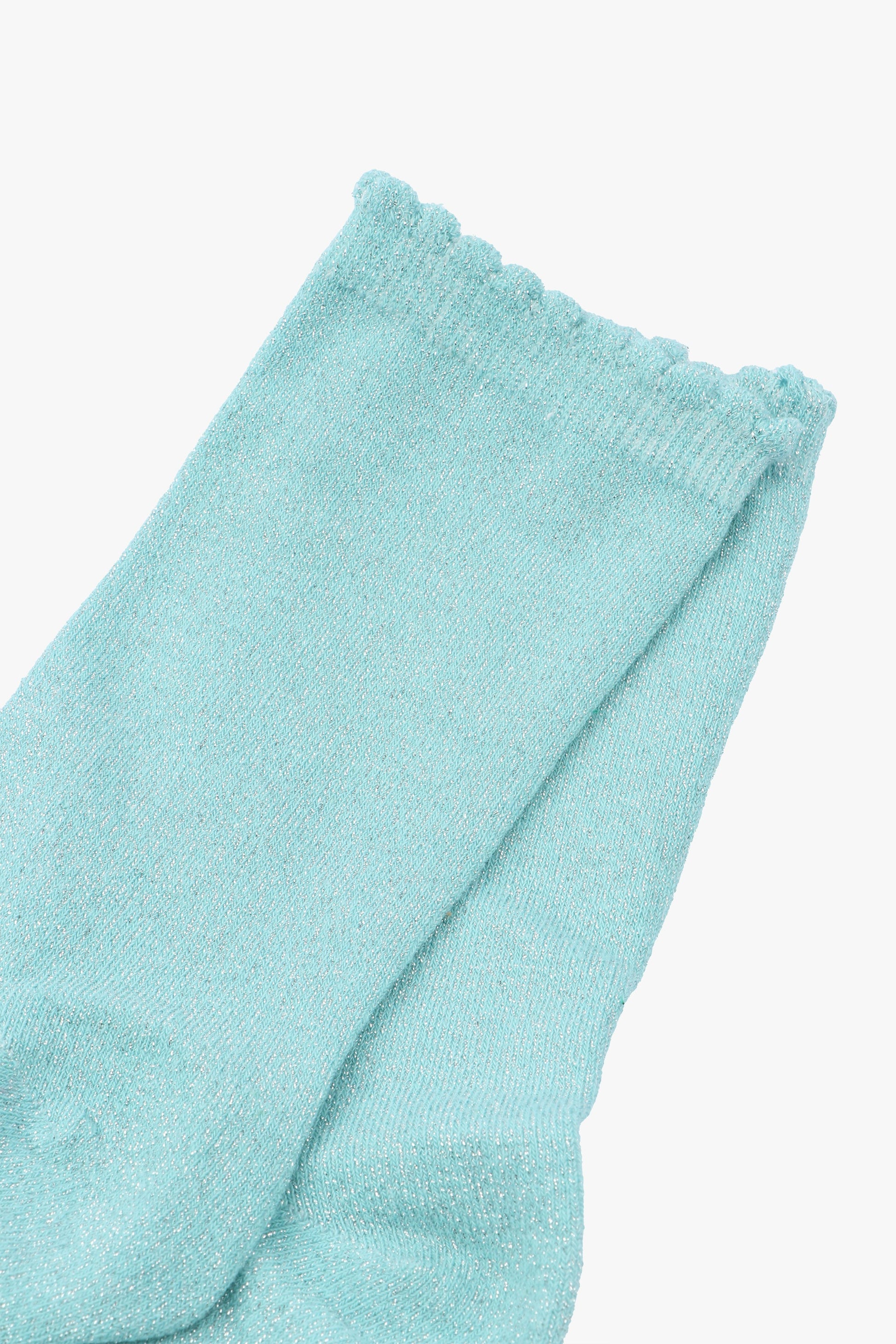 close up of the duck egg blue and silver glitter socks and scalloped cuffs