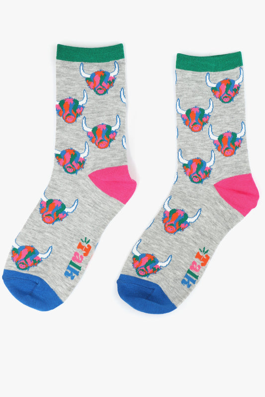 grey bamboo socks with an all over multicoloured highland cow print pattern