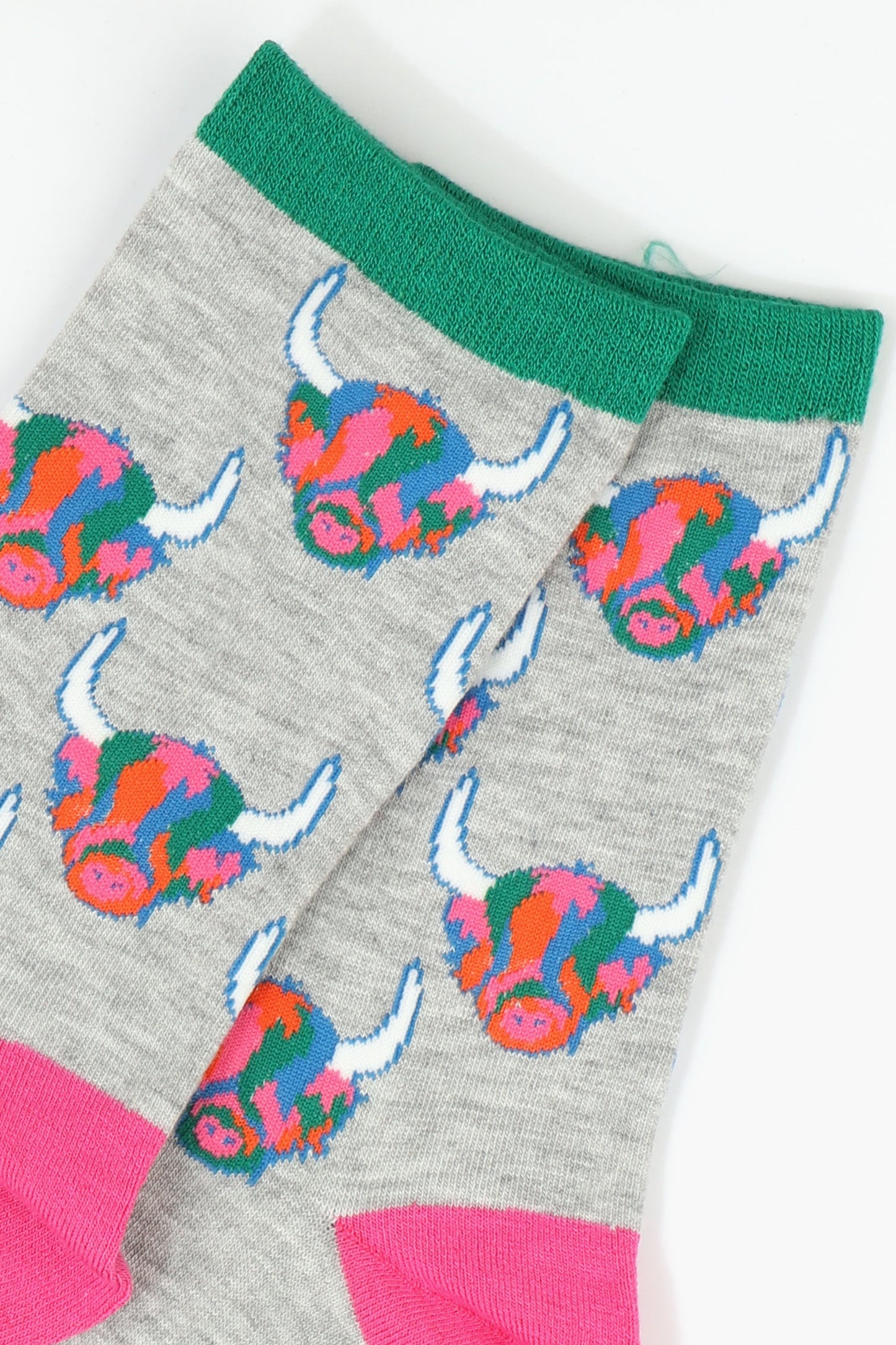 womens grey ankle socks with green cuff and pink heel with an all over pattern of multicoloured highland cow faces