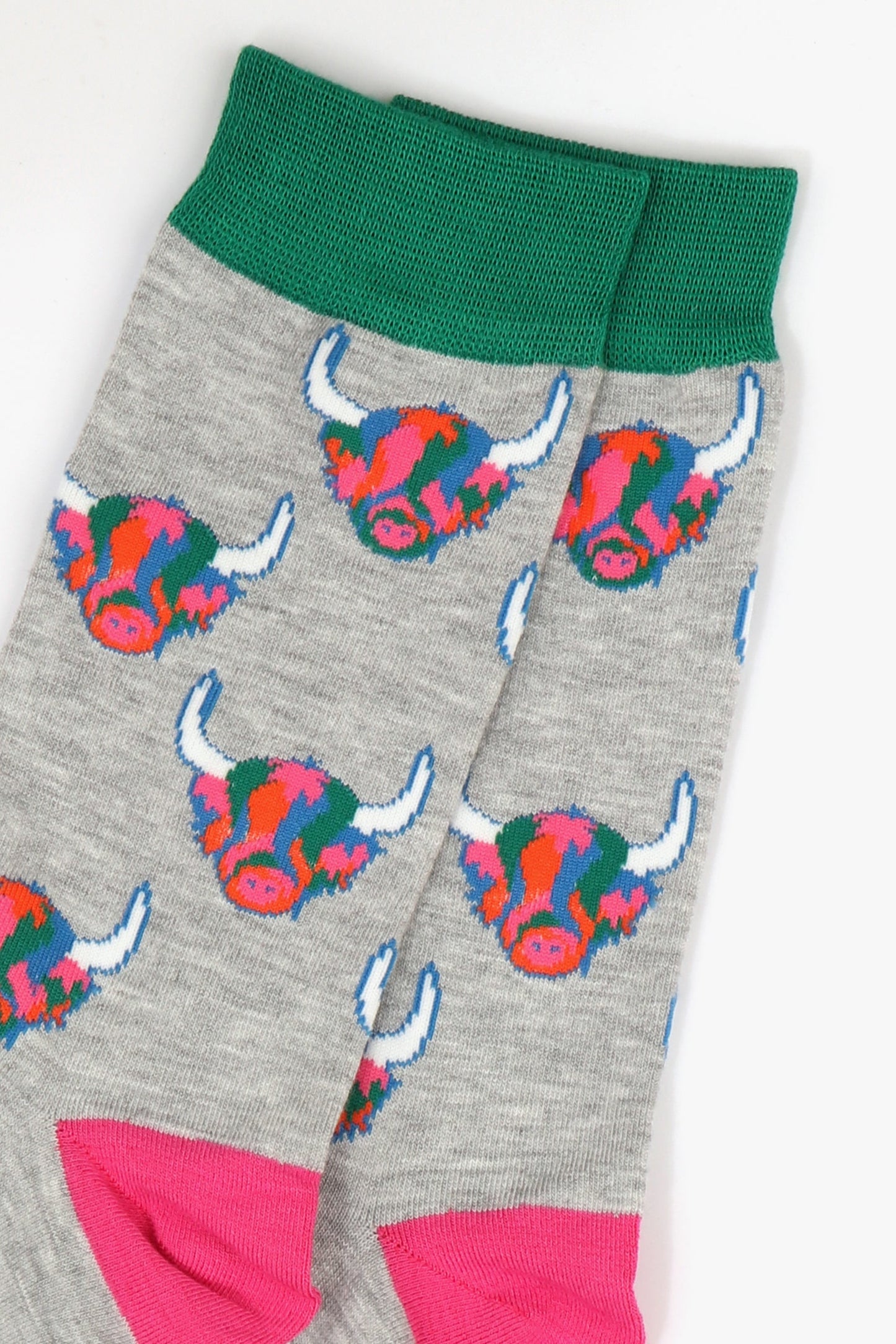 mens grey bamboo socks with green cuff and pink heel with an all over pattern of rainbow coloured highland cow faces