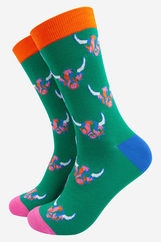 mens green dress socks with an all over pattern of multicoloured highland cow faces
