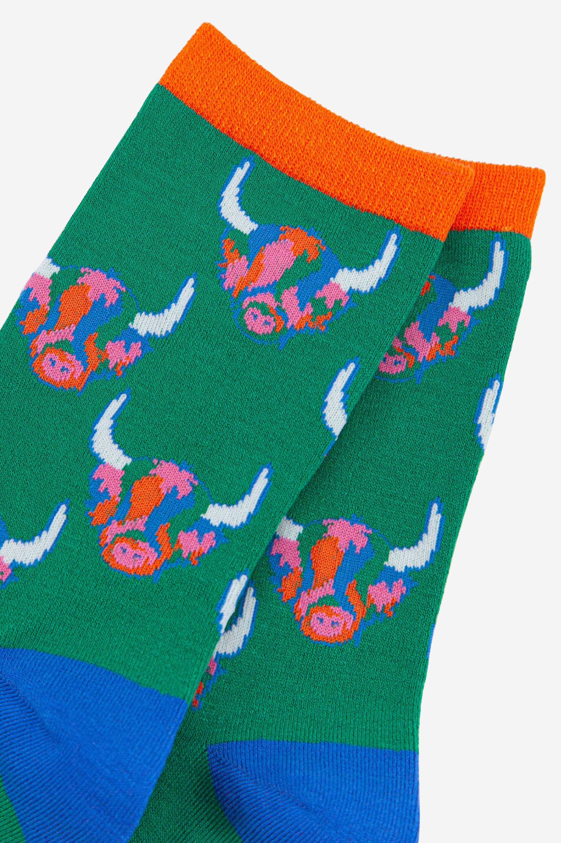 womens bamboo ankle socks in green with an all over rainbow coloured highland cow pattern