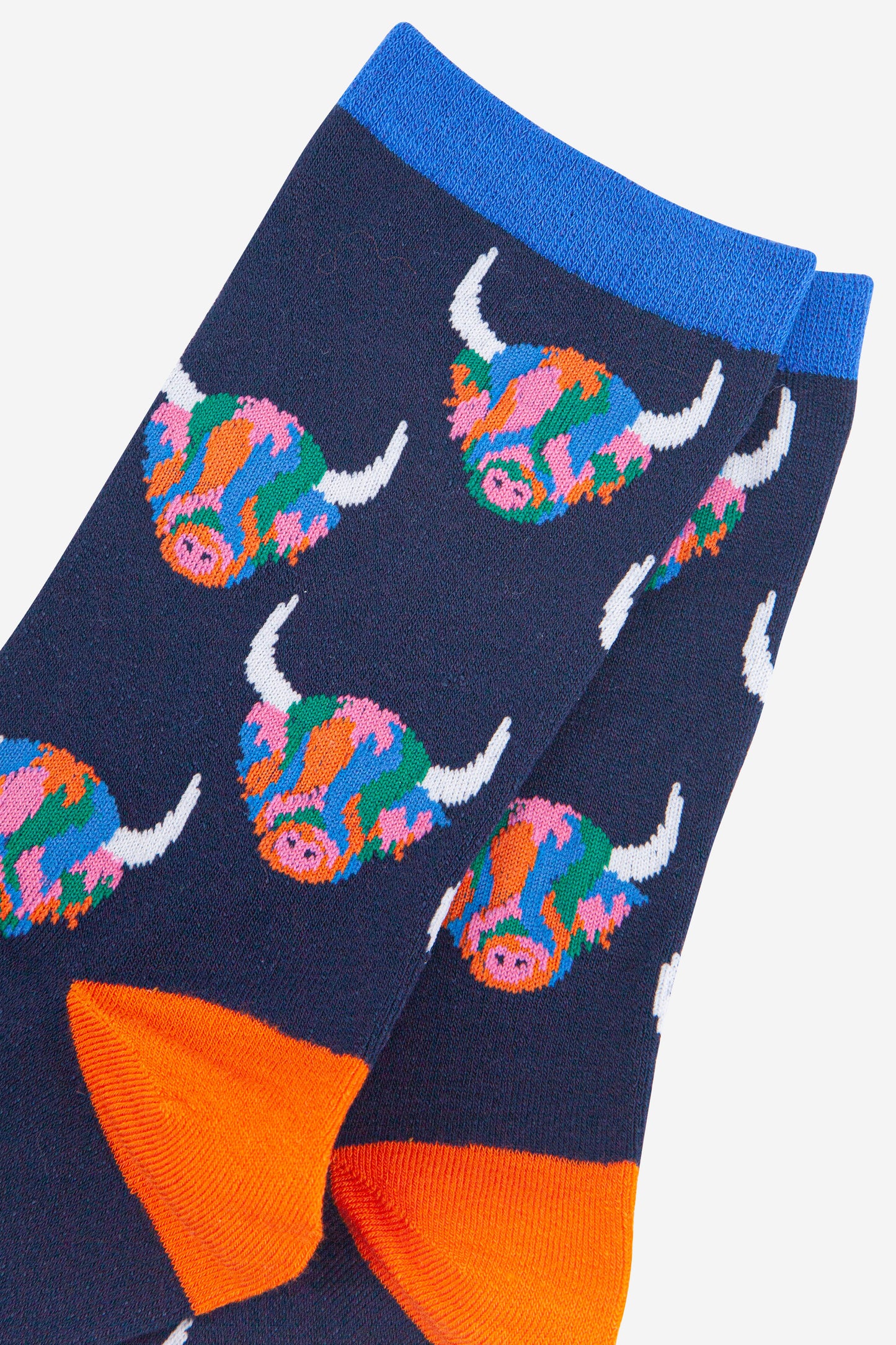 close up of the rainbow highland cow pattern on the bamboo socks