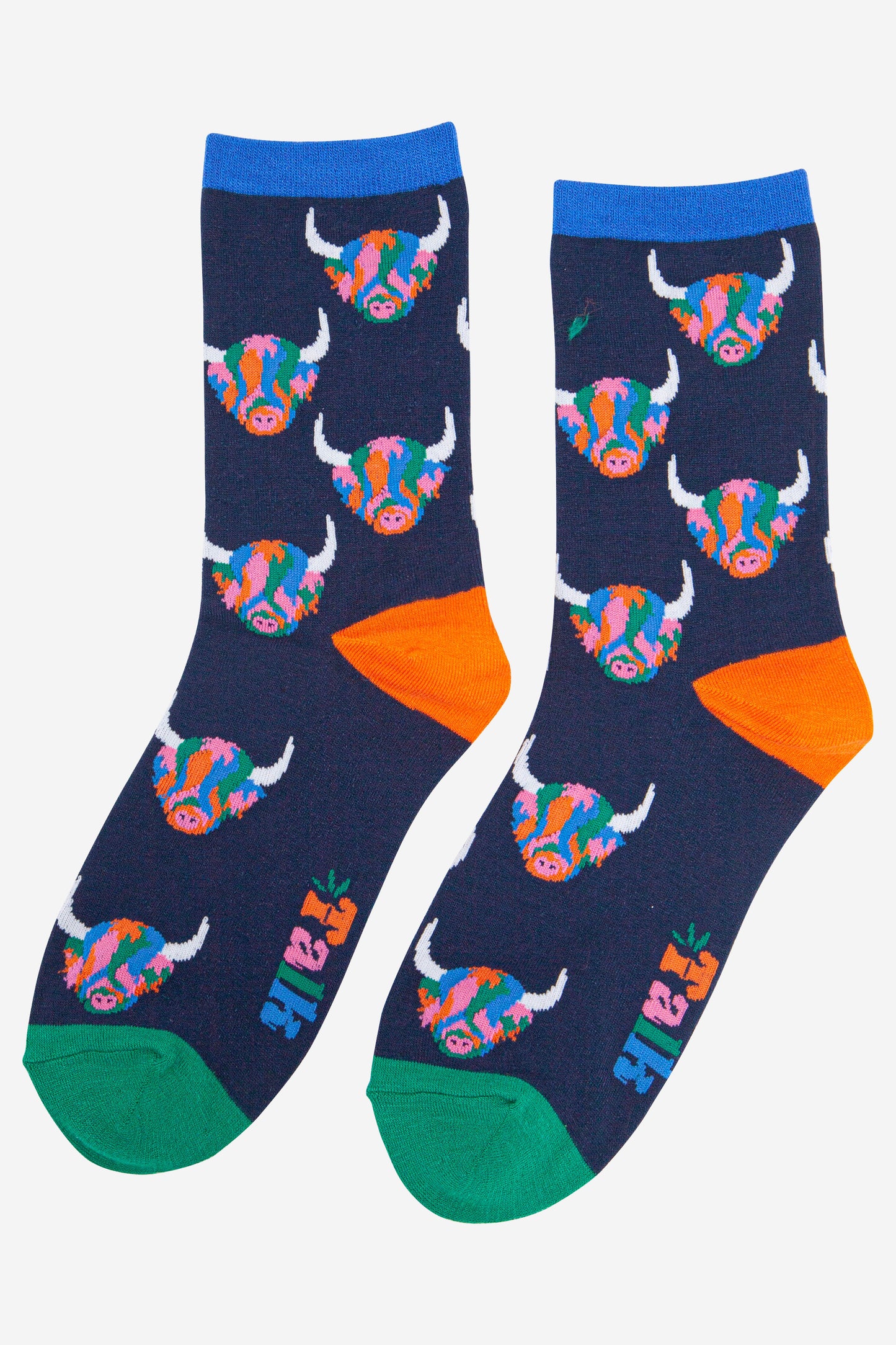 womens navy blue ankle socks with blue cuff, orange heel and green toe with an all over pattern of multicoloured highland cow faces