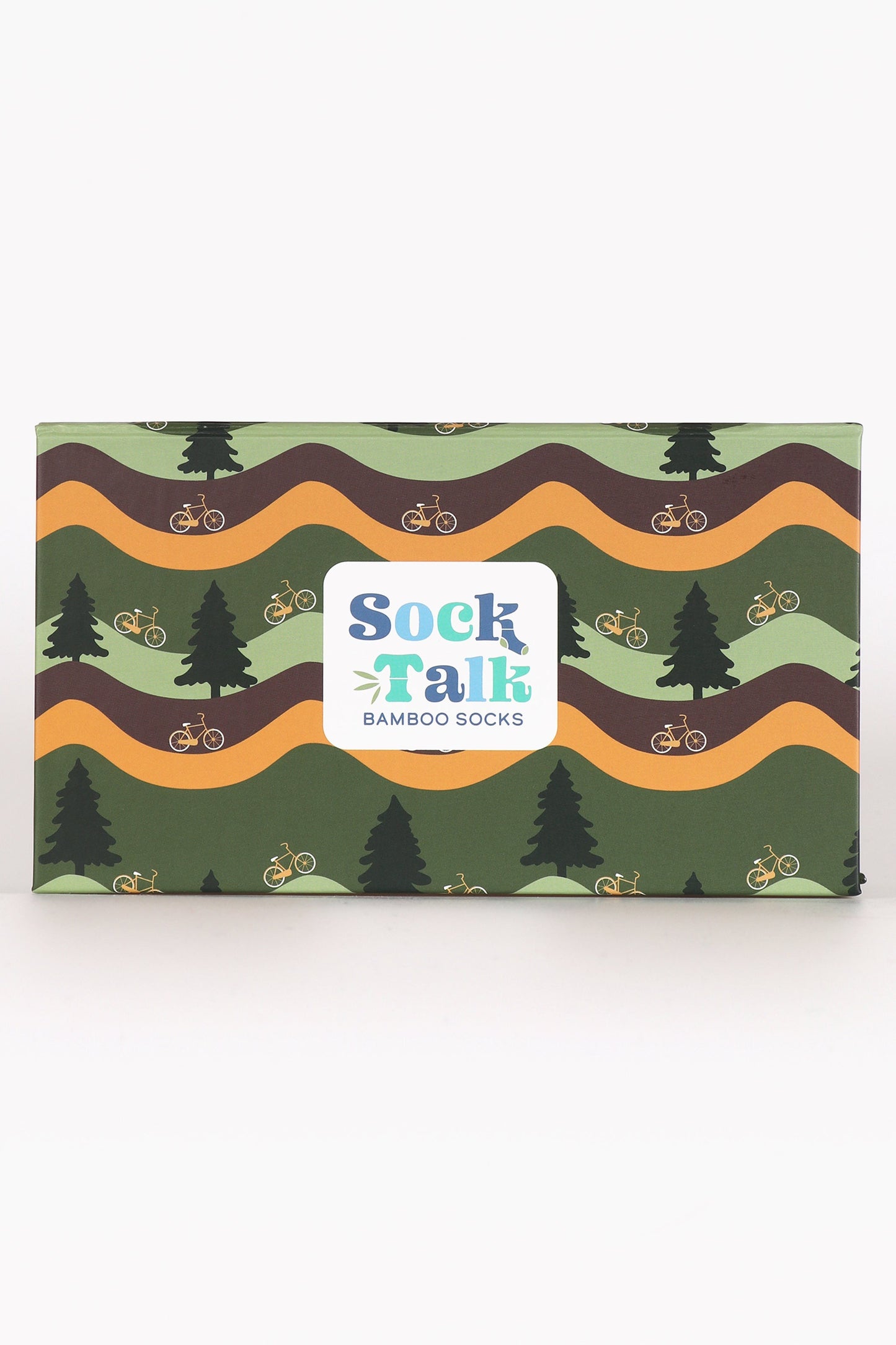 green gift box with wavy yellow and brown stripes, featuring green forest trees and mountain bikes