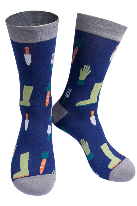 navy blue, grey bamboo socks featuring garden tools, boots, gloves and carrots