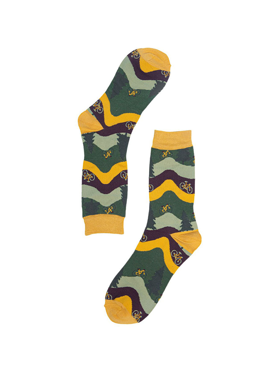 green, yellow and brown socks with a pattern of trees and mountain bikes
