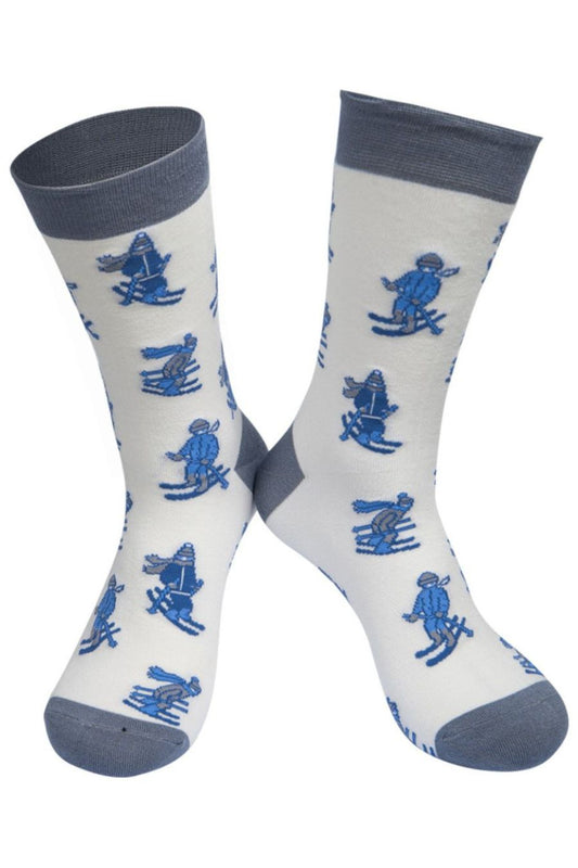 white, grey and blue bamboo dress socks with cartoon skiers on them
