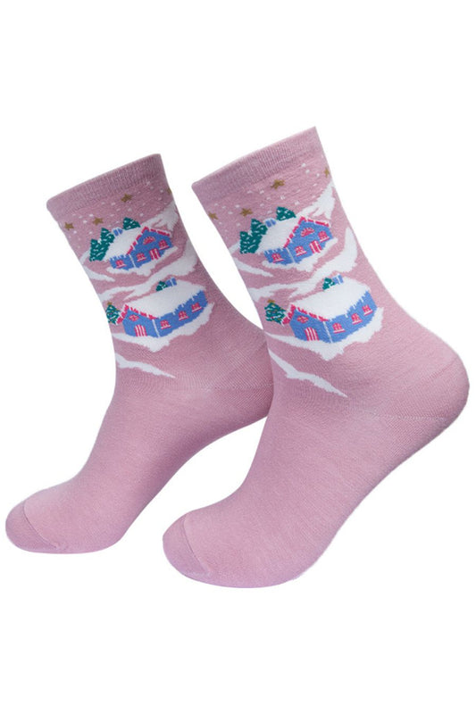 pink bamboo socks artistically designed to look like chalets in the snow