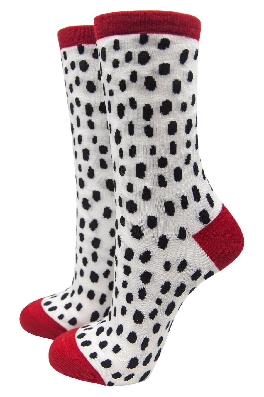 bamboo ankle socks with an all over white and black dalmatian print., red toe, heel and trim
