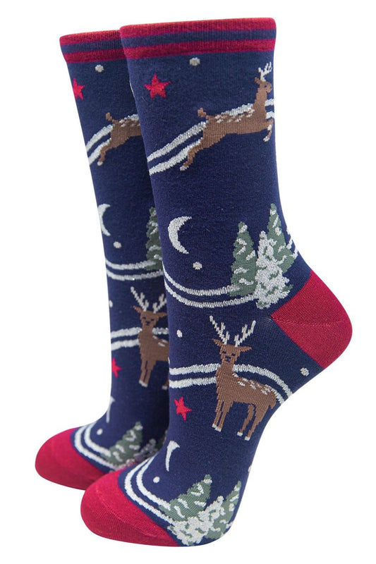 navy blue ankle socks with reindeer, snow covered xmas trees and stars and moons