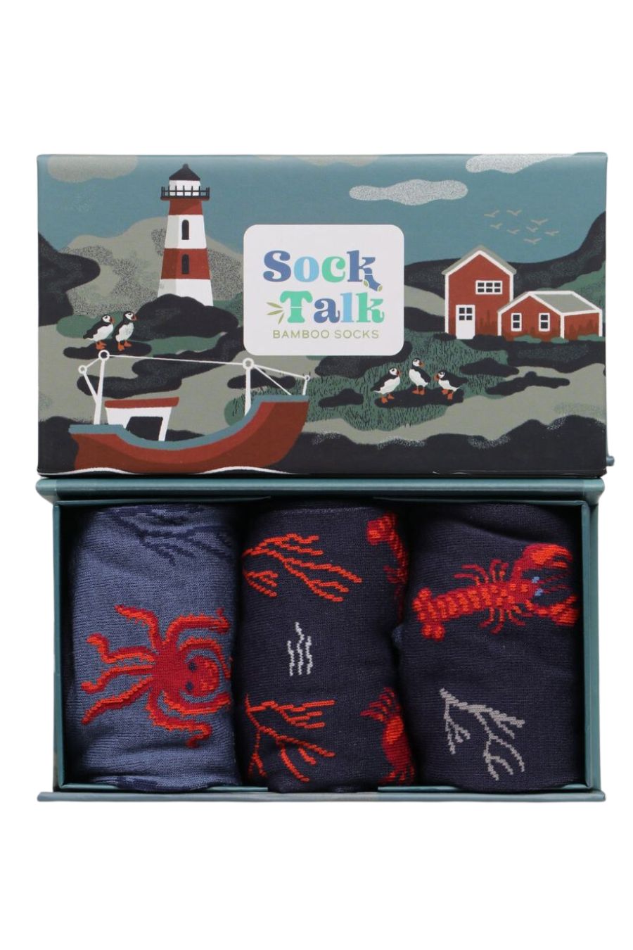 artistically designed gift box looking like a seaside harbour with fishing boat and lighthouse with three pairs of bamboo socks