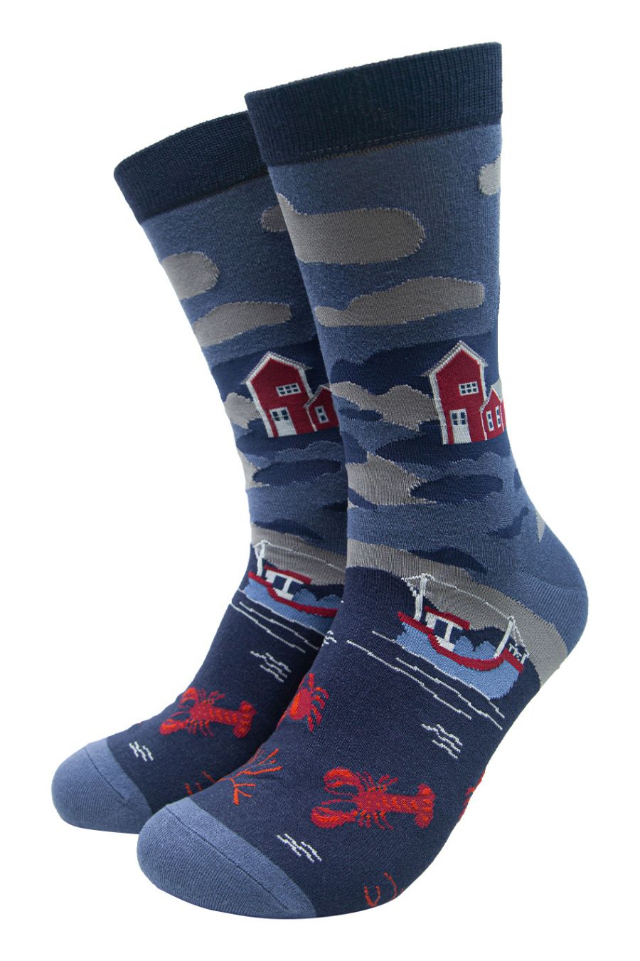 blue dress socks designed to look like a seaside scene with fishing boats, shoreline and lobsters in the water