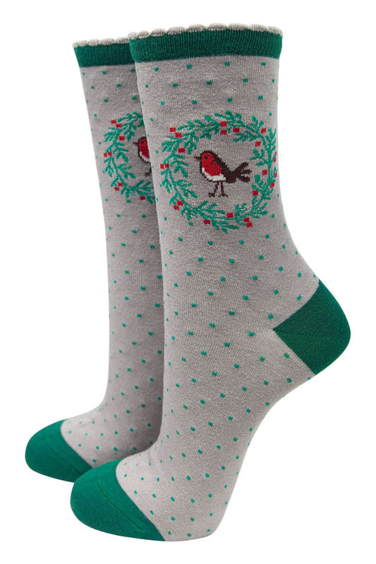 grey and green bamboo socks with a red robin bird surrounded by a holly wreath