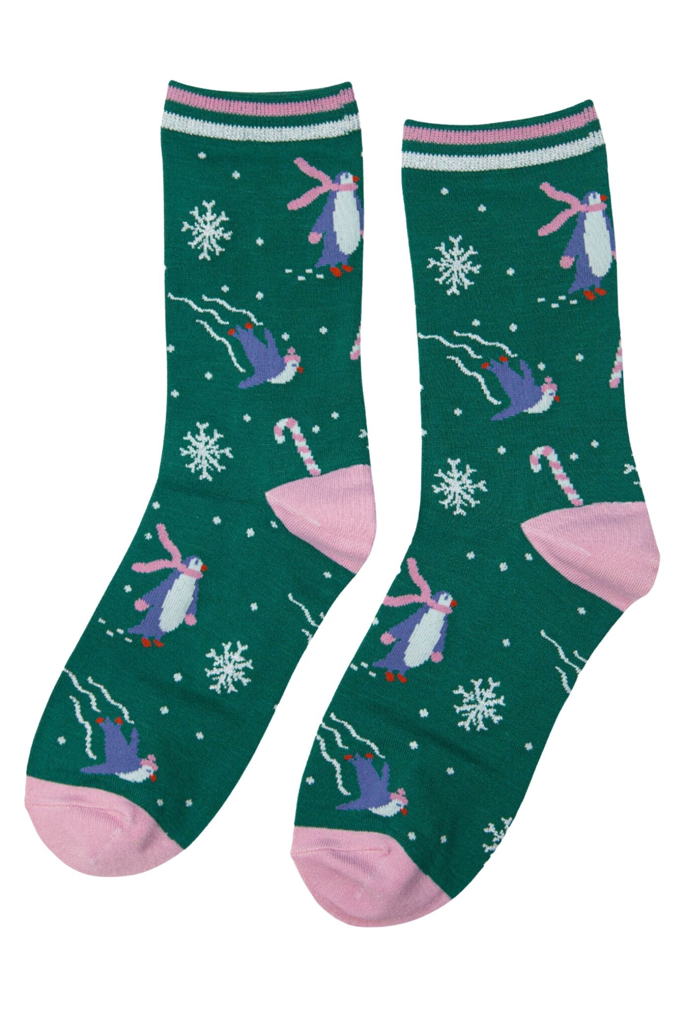green glitter xmas socks featuring skating penguins