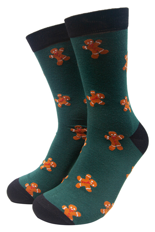 green dress socks with a pattern of gingerbread men all over them