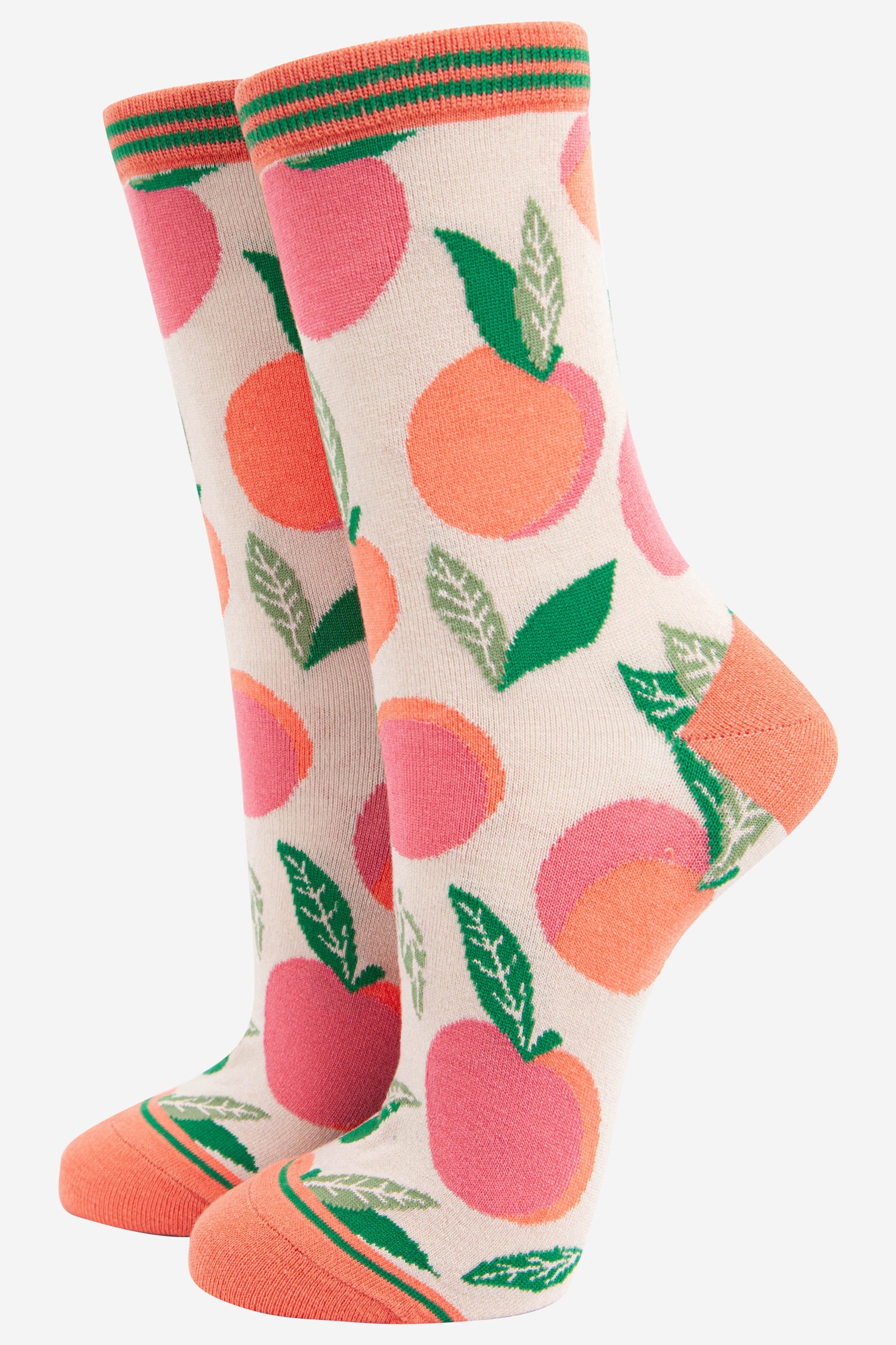 cream and pink bamboo socks with an all over pattern of peach fruit
