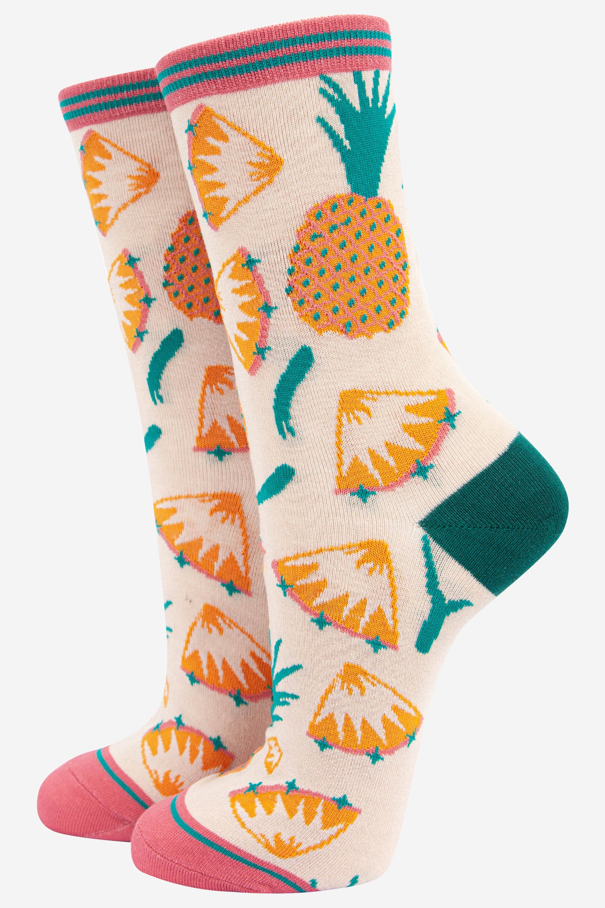 womens cream bamboo socks with an all over yellow pineapple and pinapple slice pattern, with pink toe and pink stiped cuff