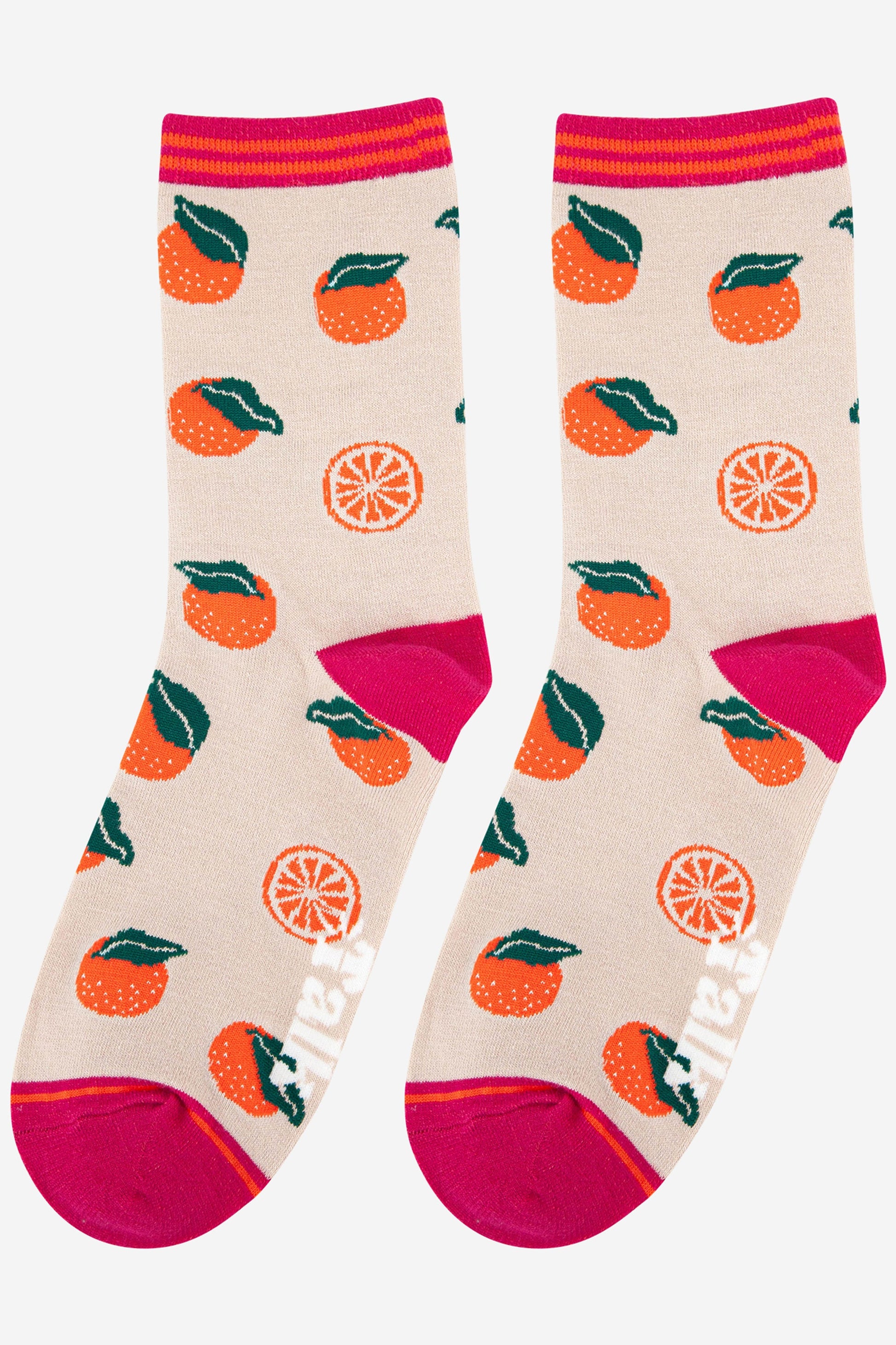 womens oranges fruit socks made from bamboo. Cream socks with oranges all over and a pink toe, heel and cuff