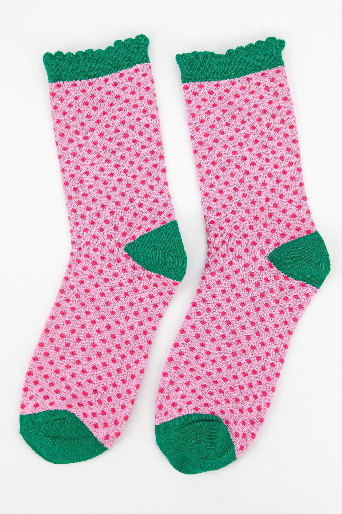 pink polka dot sparkly ankle socks with a green scalloped edge