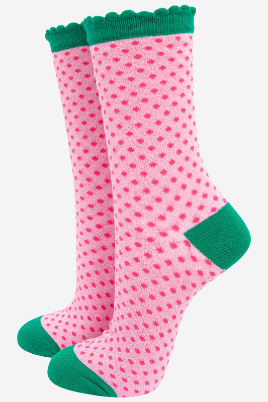 pink polka dot glitter socks with a green heel, toe and scalloped edge. With an all over glitter sparkle