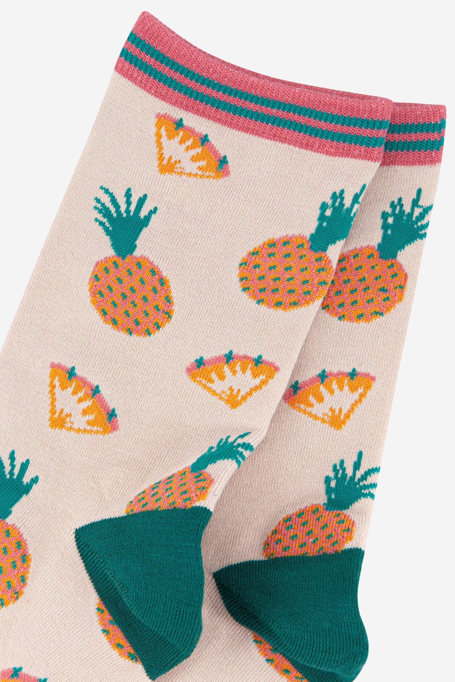 close up of the pineapple and pineapple slice pattern on the ankle socks