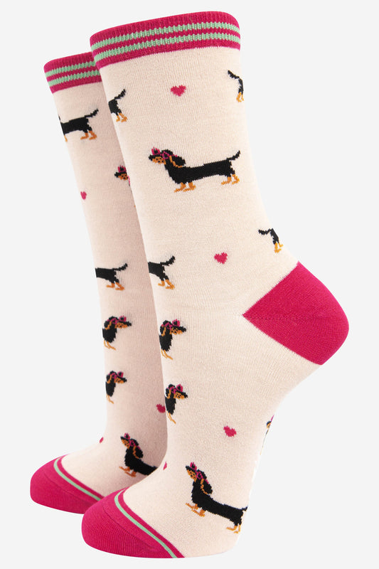 cream and pink bamboo ankle socks featuring a black miniature dachshund wearing pink love heart glasses