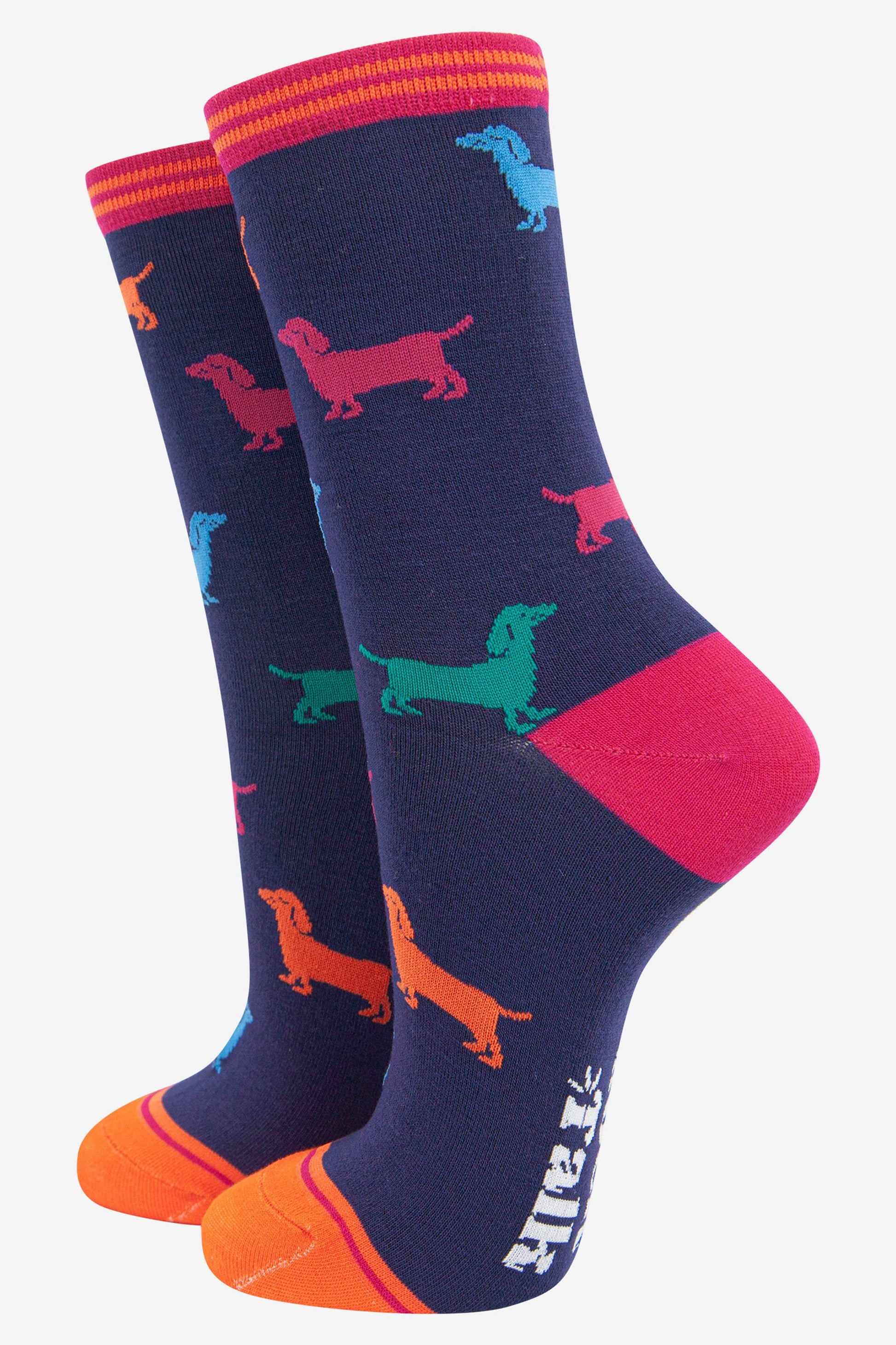 navy blue and pink bamboo ankle socks featuring multicoloured sausage dogs and a striped cuff