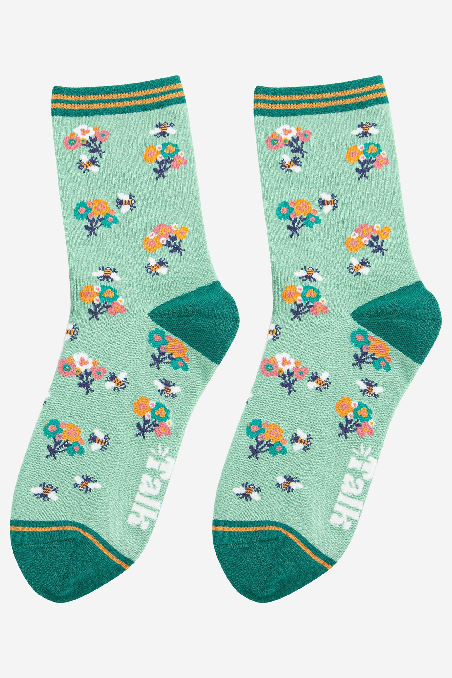 womens green bamboo bee socks with a floral print pattern and stiped cuff