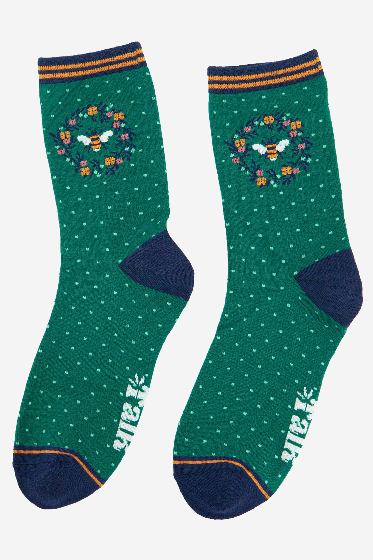 womens green bamboo socks with a honeybee and floral print motif on the ankle