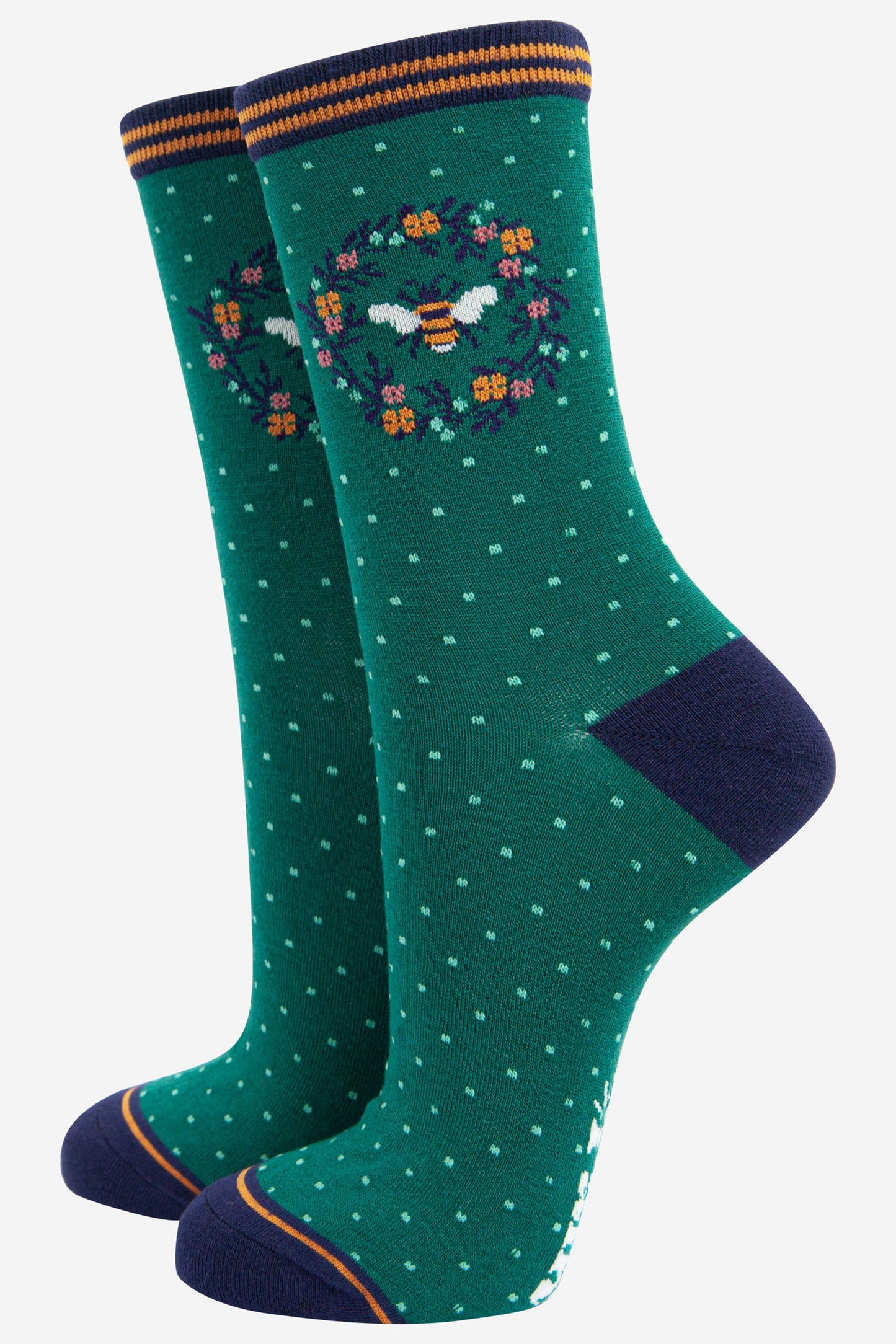 green and navy blue ankle socks featuring a large bumble bee in a floral wreath on the ankle
