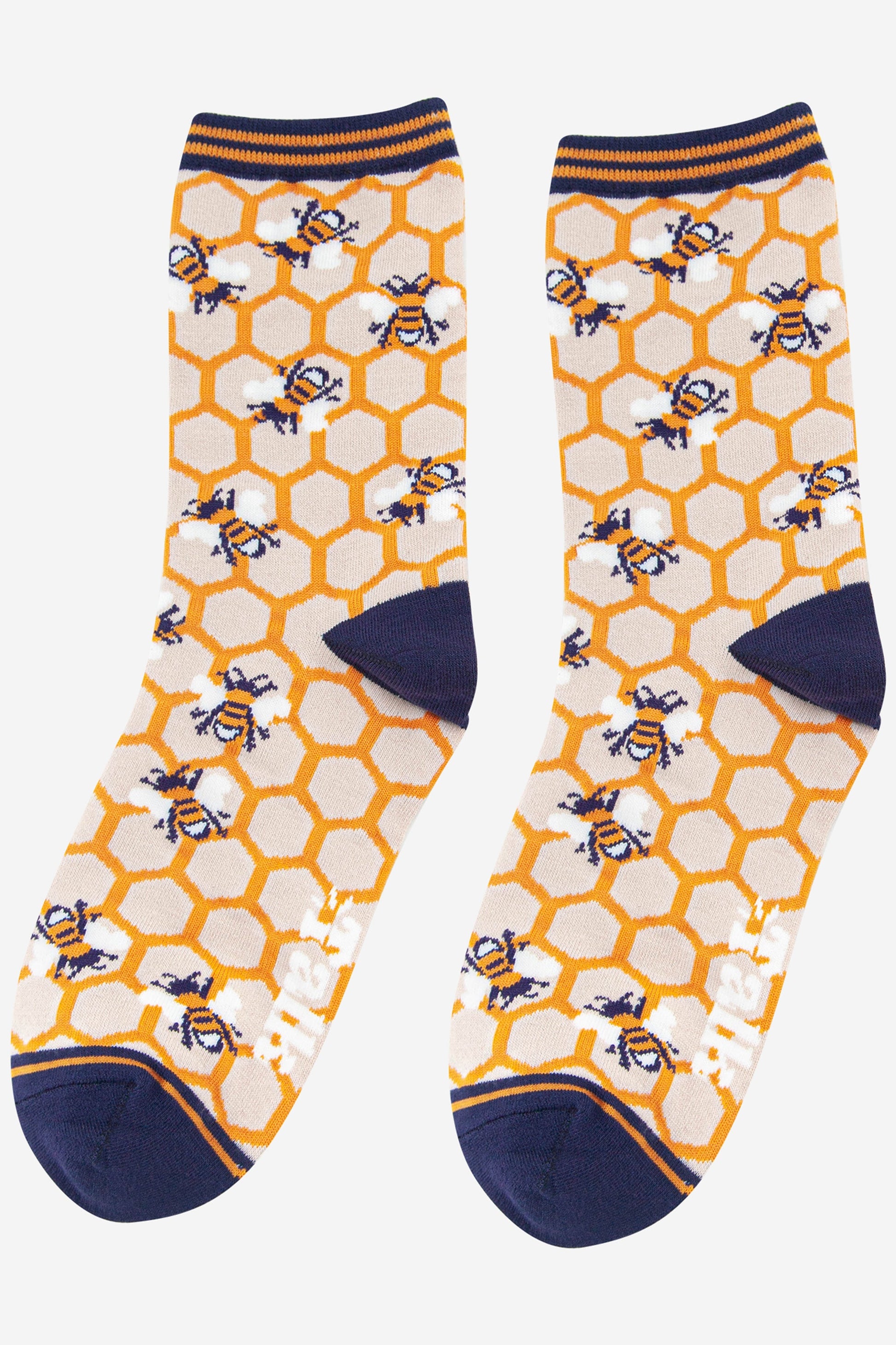 womens bees and honeycomb bamboo socks in yellow and navy blue with a striped cuff