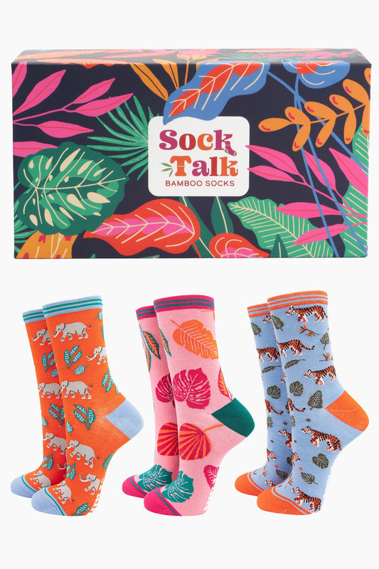 multicoloured sock gift box with an all over jungle leaf pattern and three pairs of ladies bamboo ankle socks featuring elephants, tigers and leaves