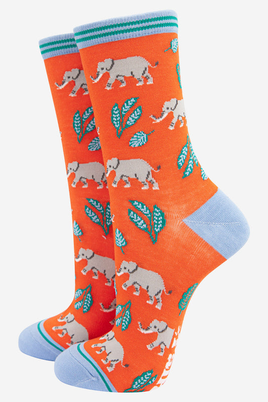 womens orange and blue bamboo socks with an all over grey elephant and green leaf pattern