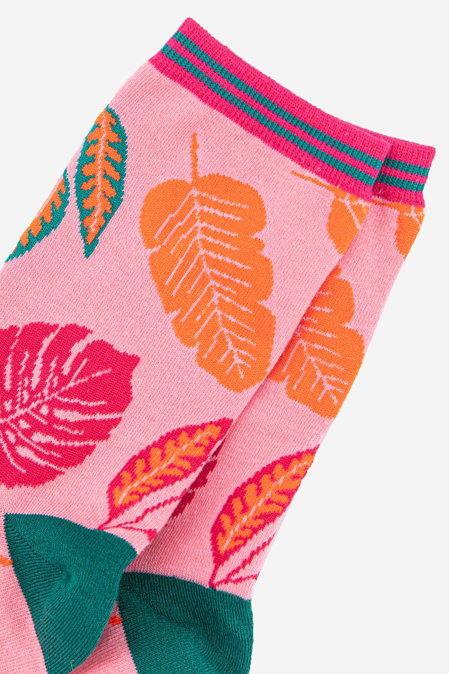 close up of the colourful leaf pattern on the pink ankle socks