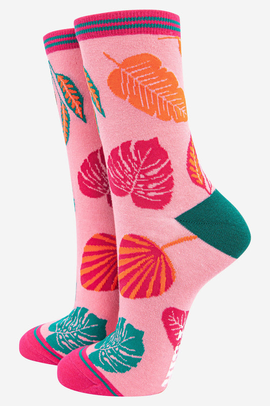 pink bamboo ankle socks with an all over pink, green and orange tropical leaf pattern
