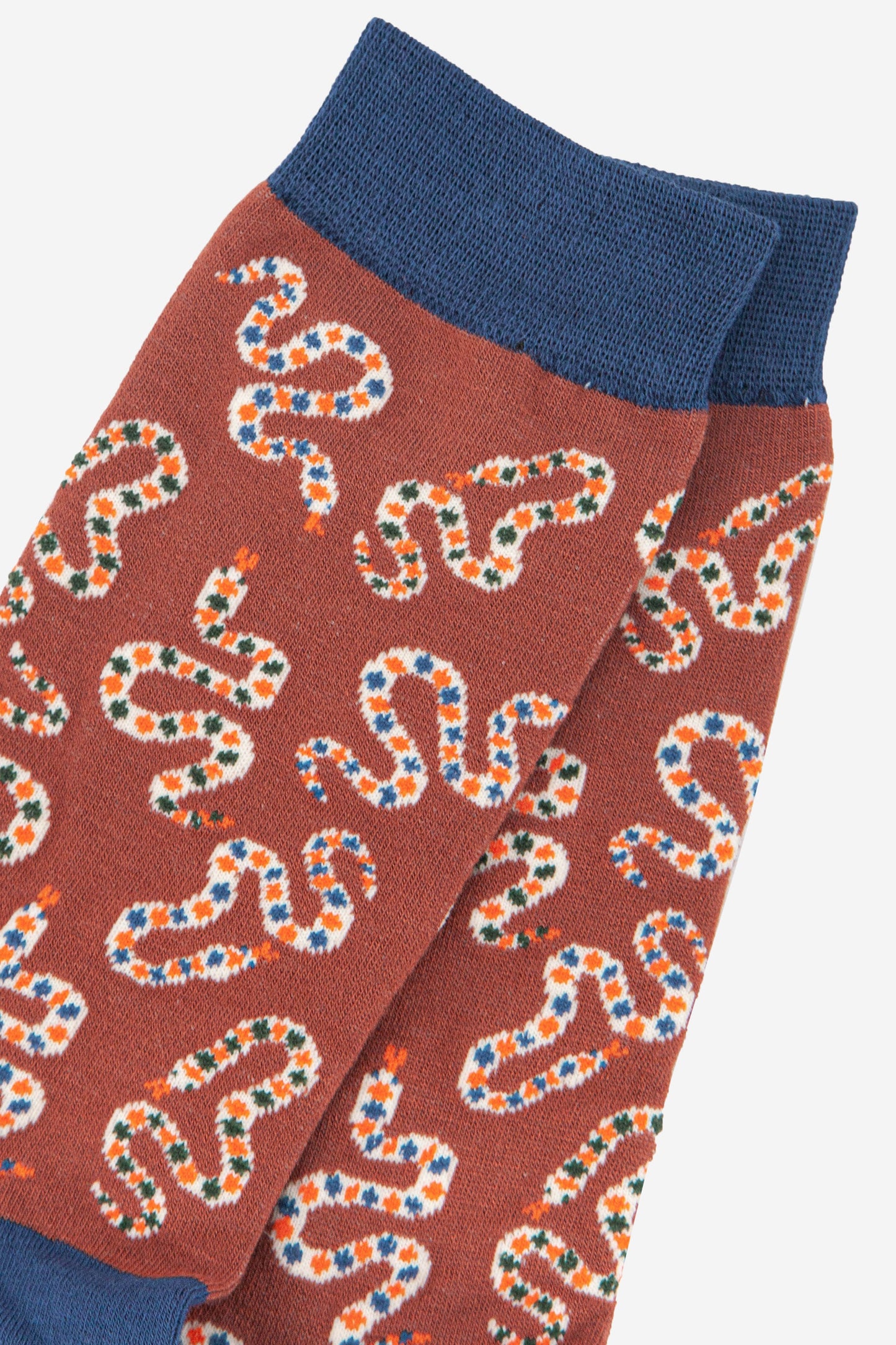 close up of the snake print patten on the mens dress socks