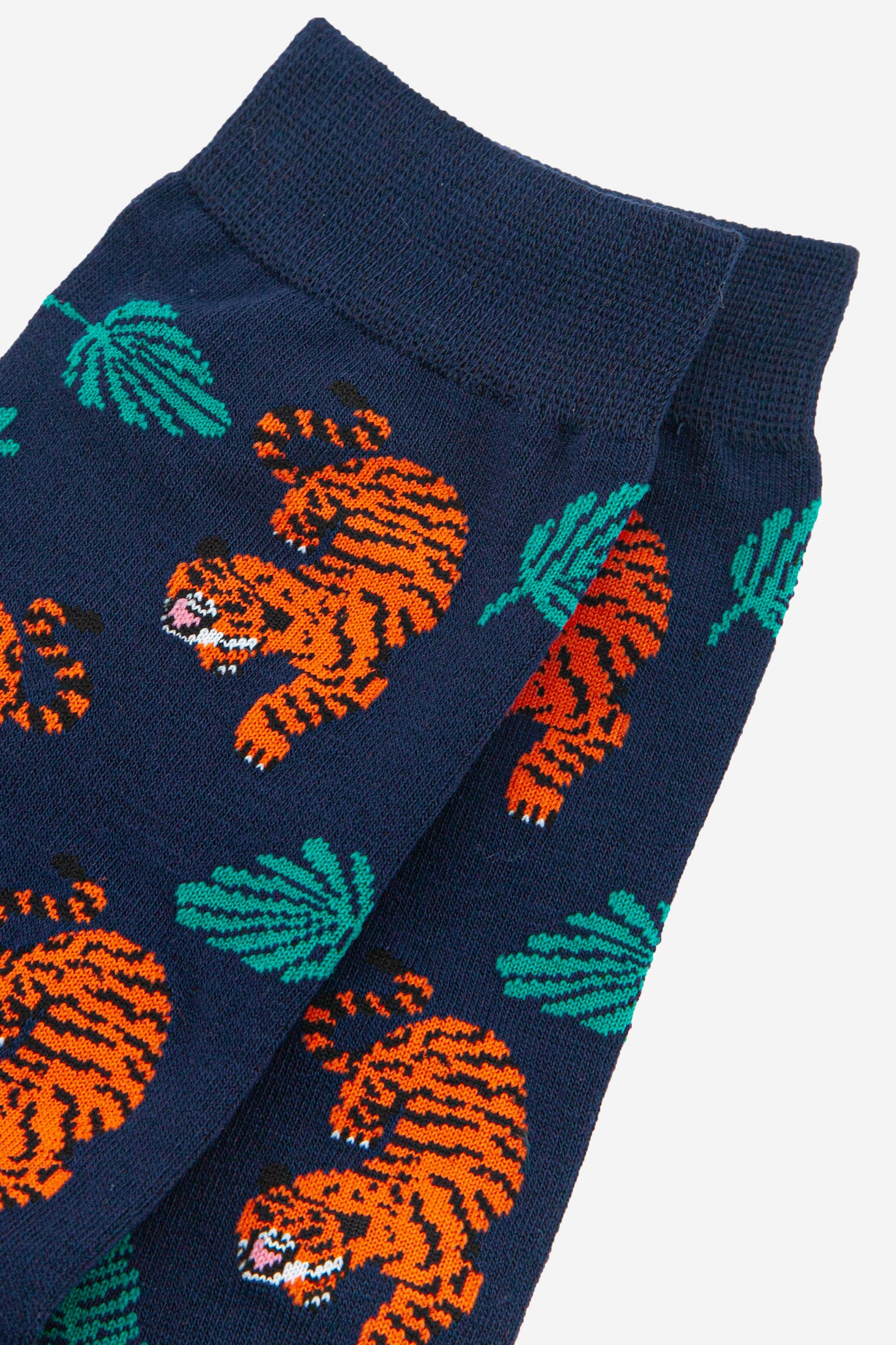 close up of the tiger and leaf pattern on the dress socks