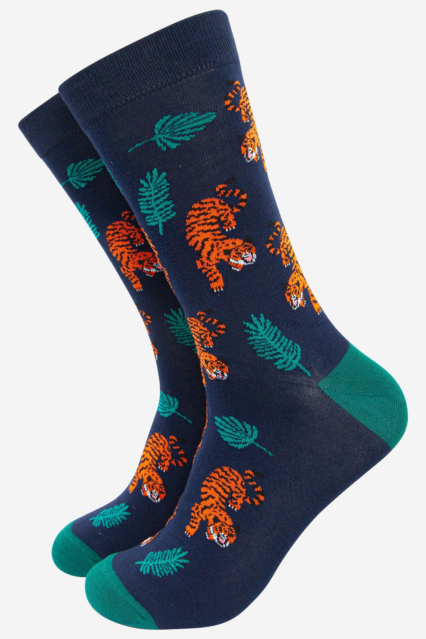 navy blue bamboo socks featuring an orange and black crouching tiger among jungle leaves