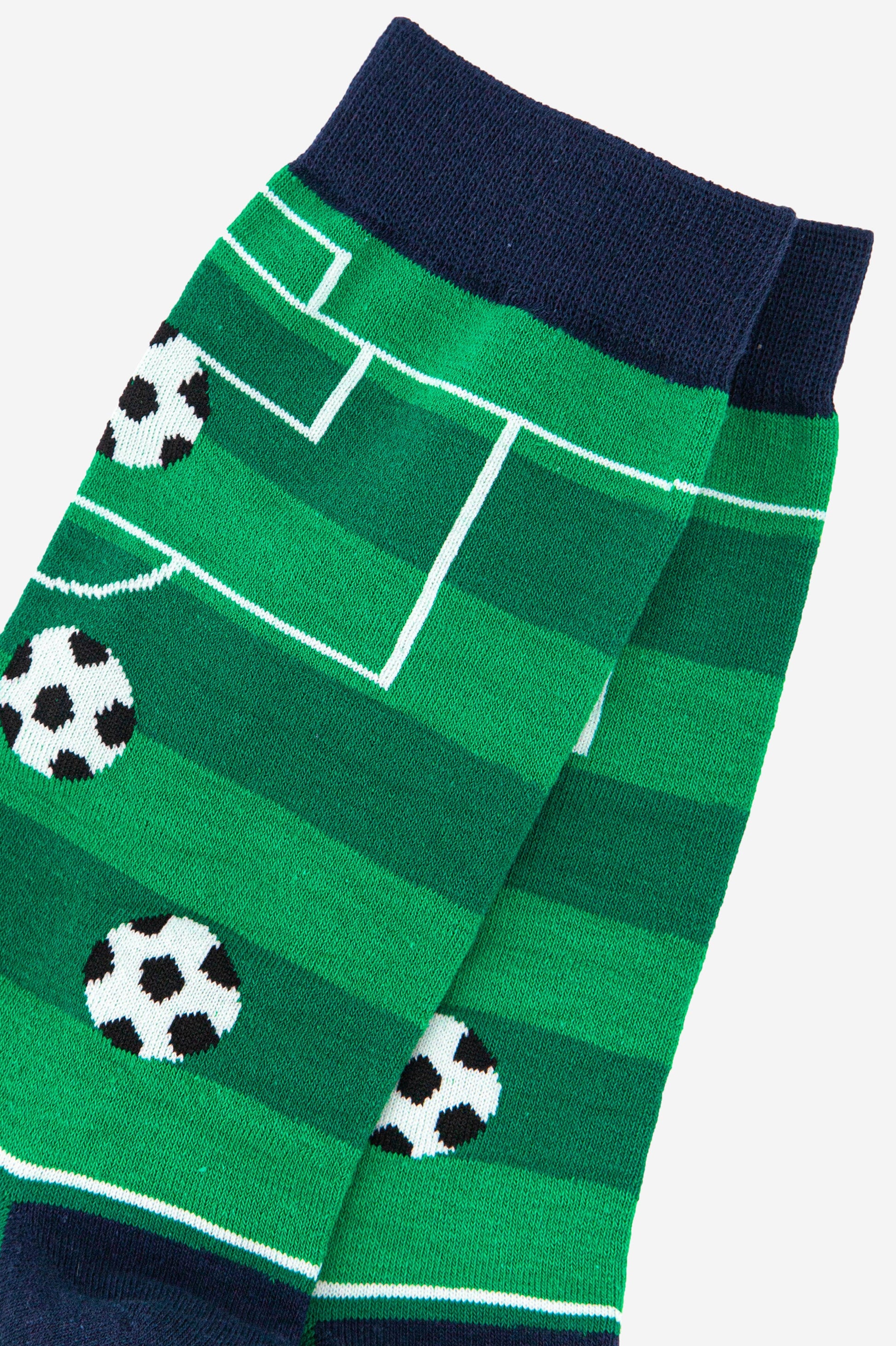 close up of the football field design on the mens dress socks