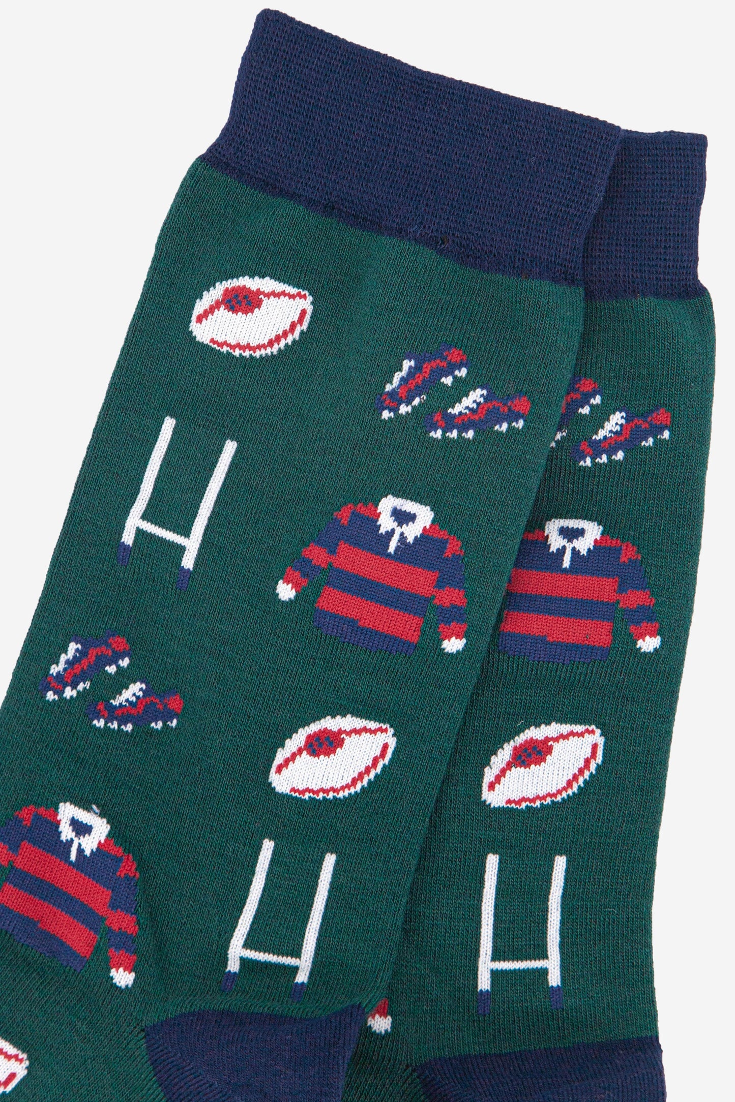 close up of the rugby goals, ball and red and blue striped rugby shirt pattern on the mens bamboo socks