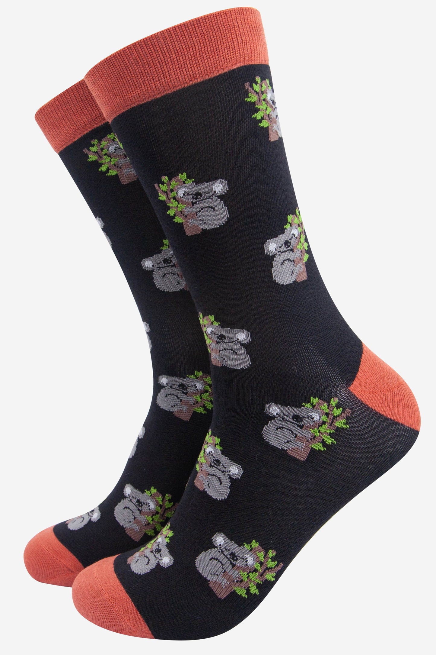 black and bamboo socks with an orange heel, toe and cuff with an all over pattern of sleeping koala bears
