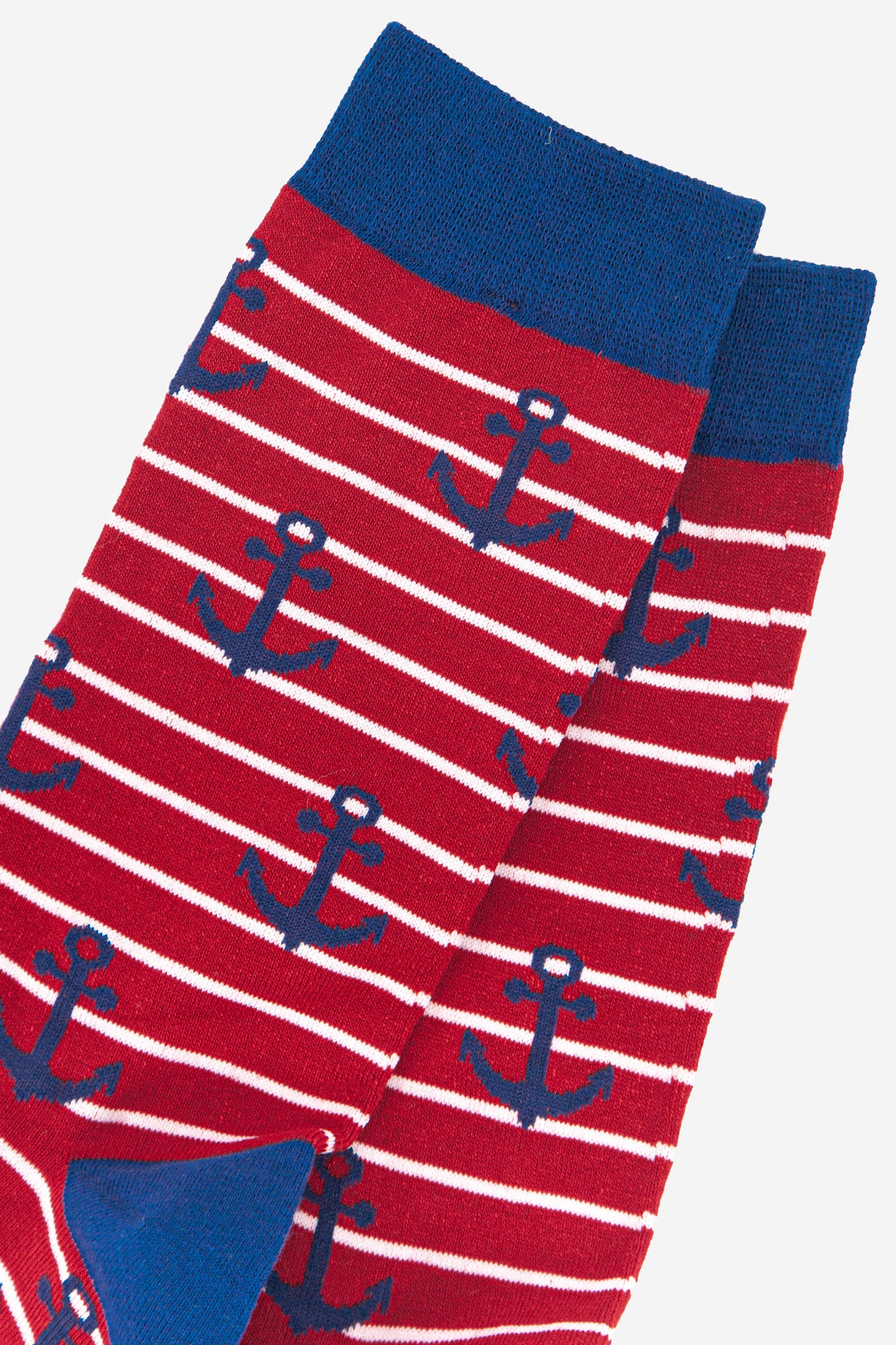 close up of the blue anchor pattern on the red and white striped socks