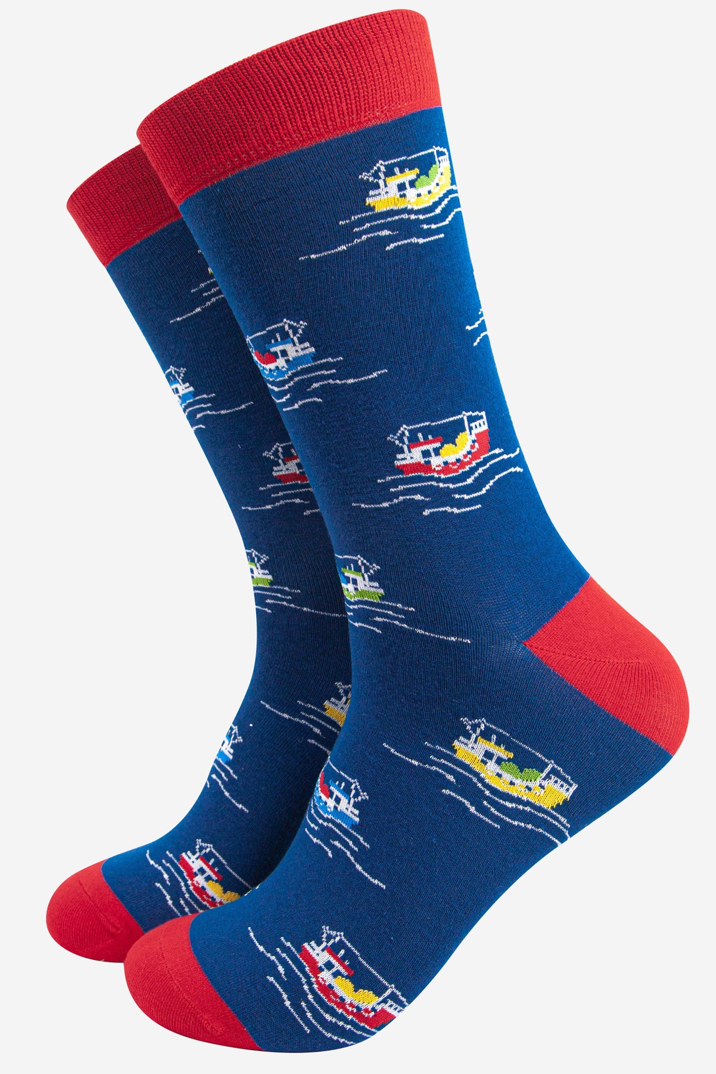 blue bamboo socks with red heel, toe and cuff with an all over pattern of colourful fishing boats at sea