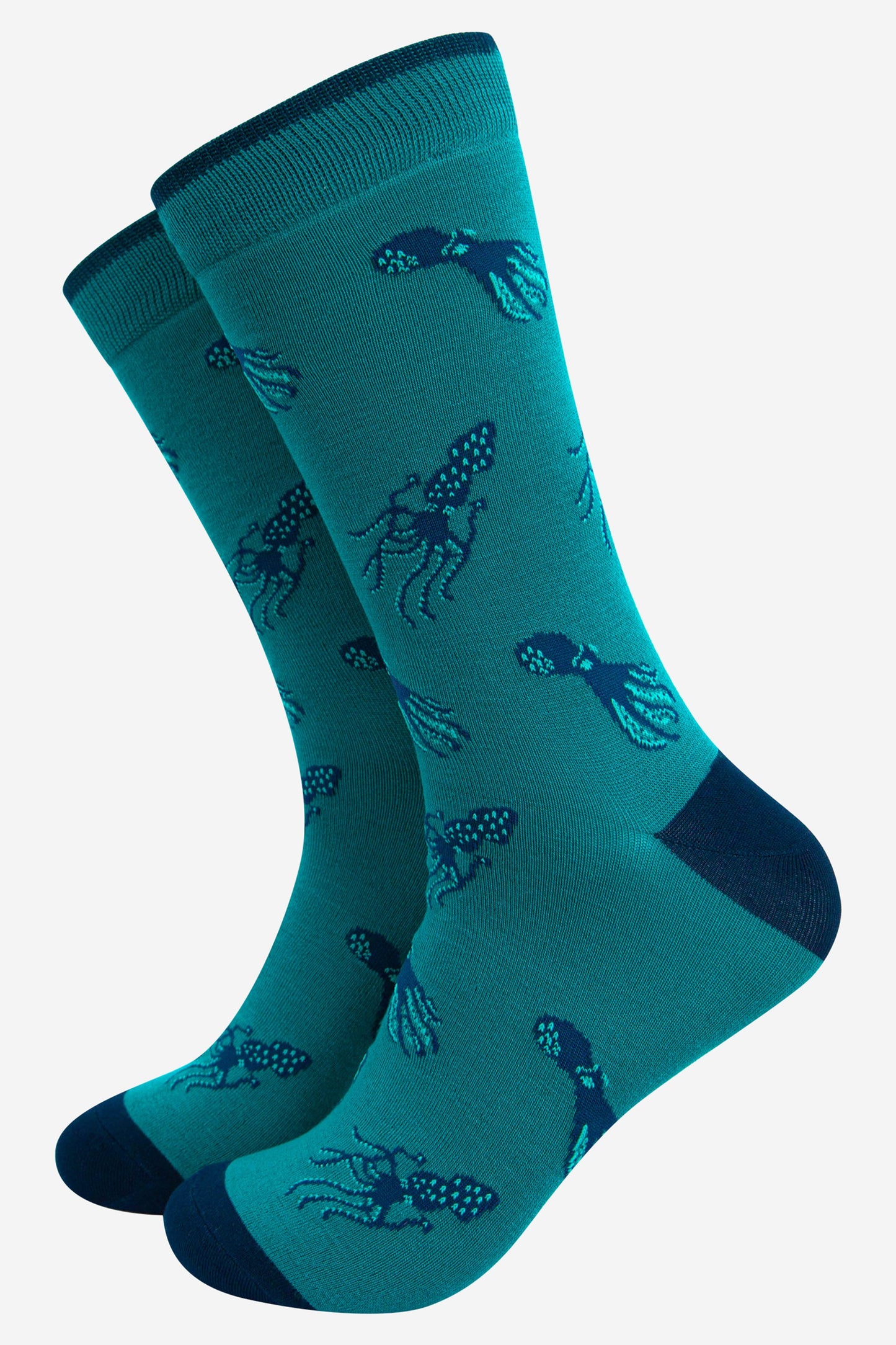teal coloured mens bamboo dress socks with an all over blue squid and octopus print pattern