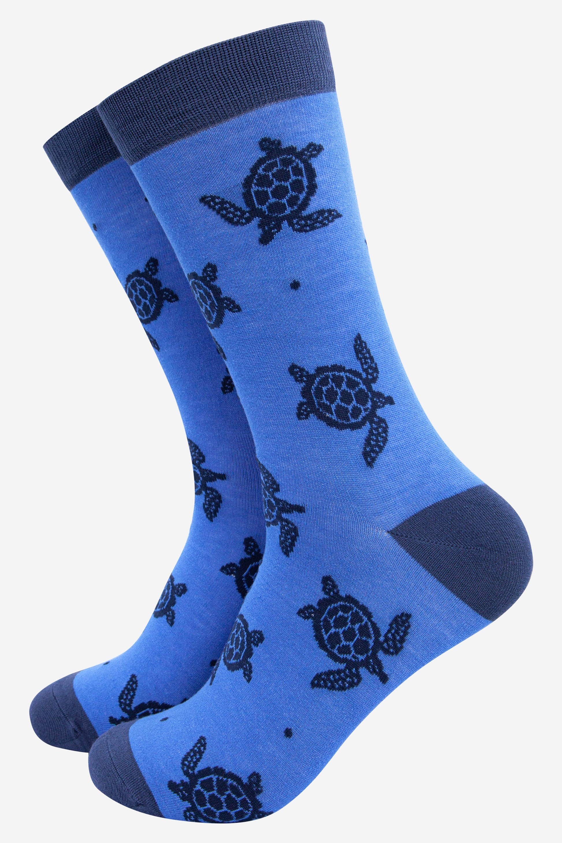 light blue bamboo socks with an all over print of a swimming sea turtle in navy blue