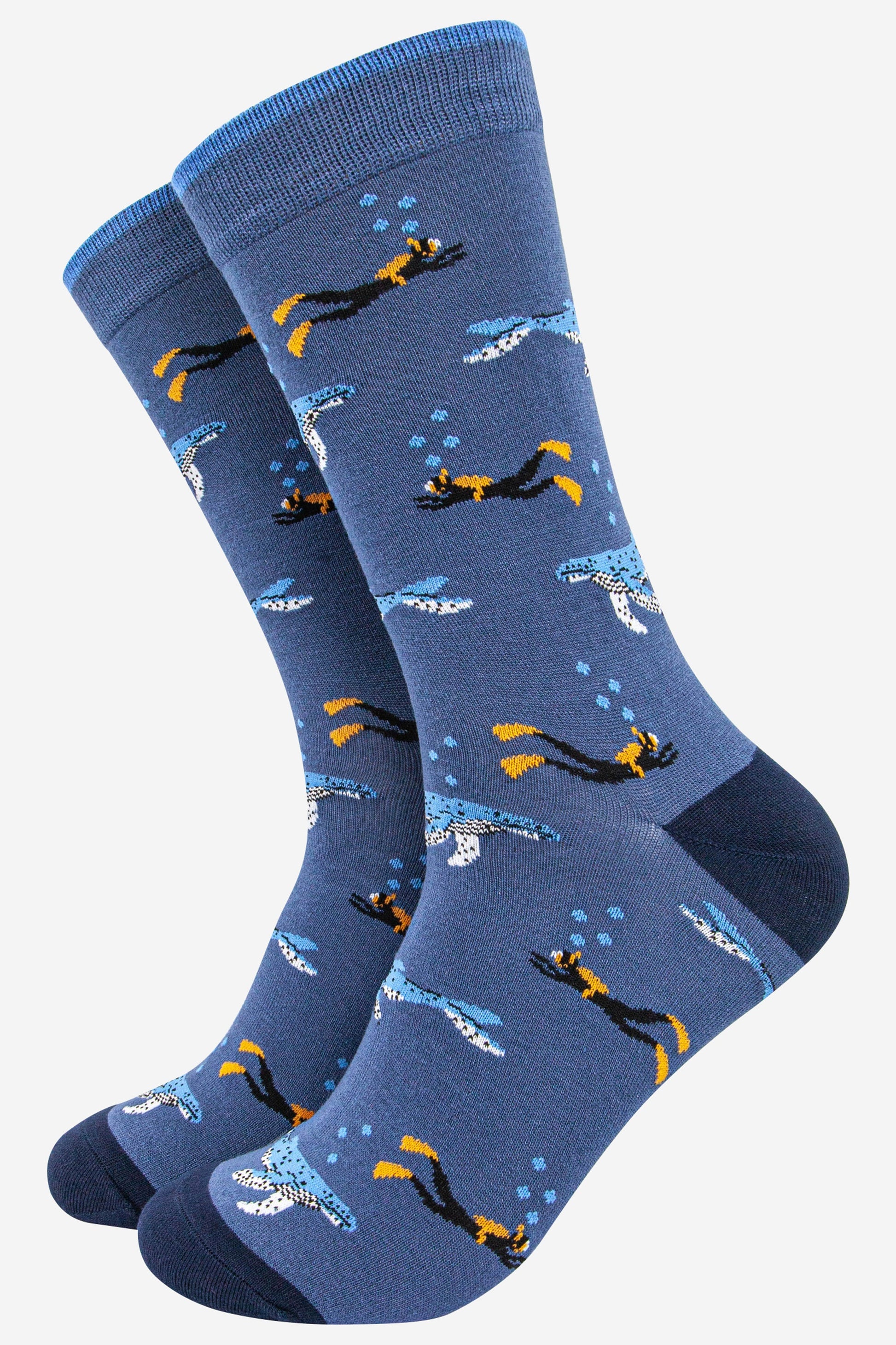 blue bamboo socks with an all over pattern of blue whales and scuba divers