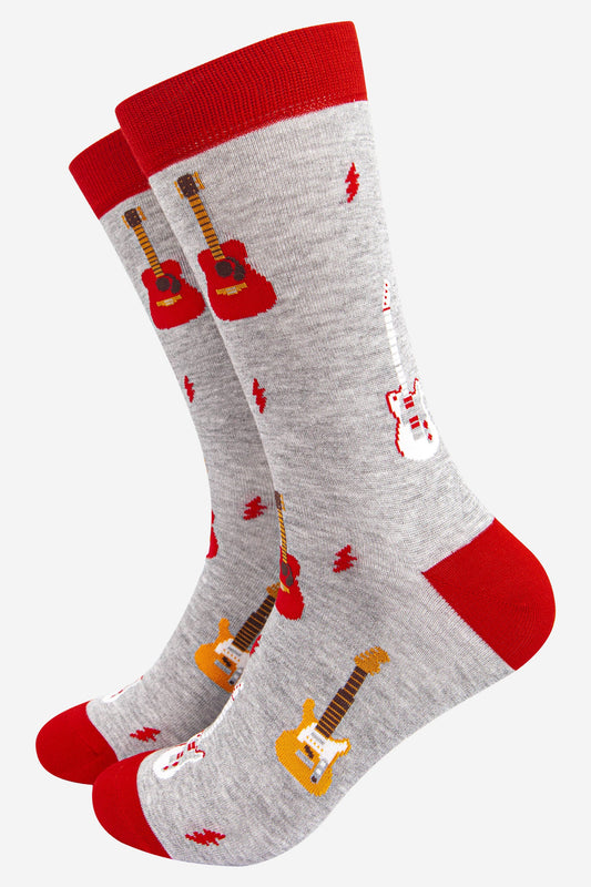 grey and red bamboo socks featuring a pattern of electic and acoustic guitars and red lightning bolts