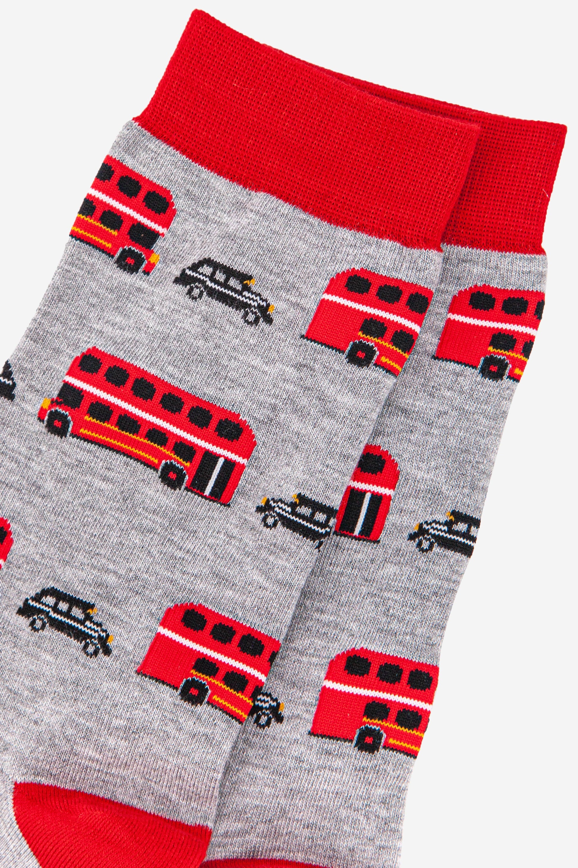 close up of the red bus and black taxi design