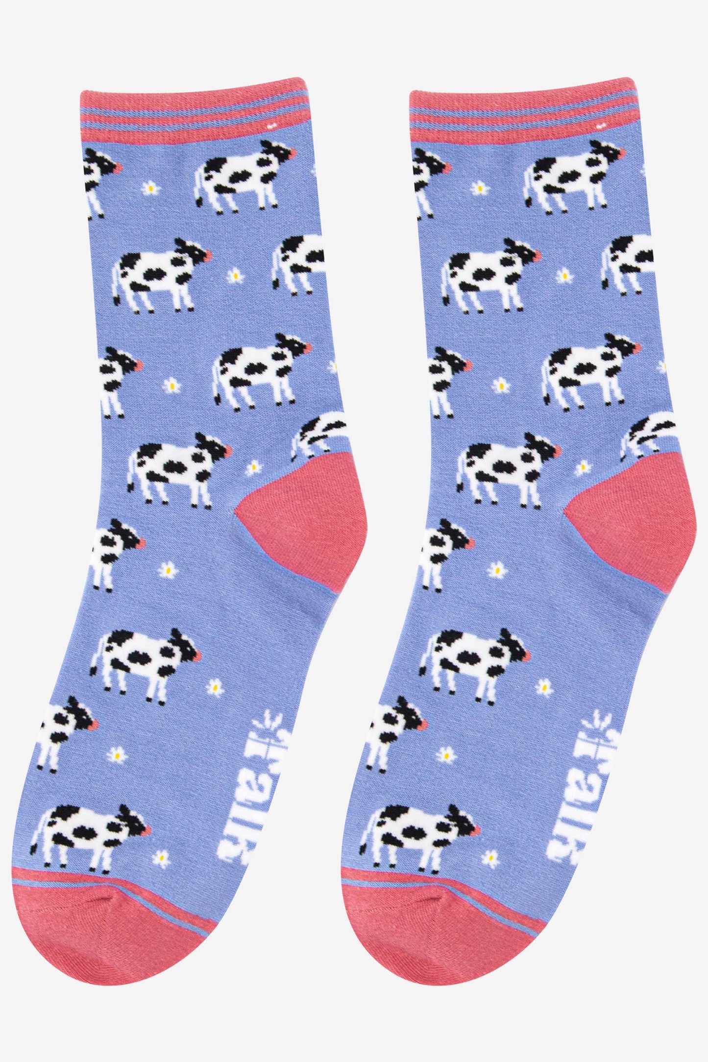 lilac bamboo socks with black and white cows all over 